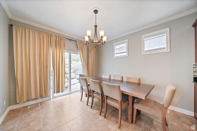 dining space with crown molding, an inviting chandelier, baseboards, and visible vents