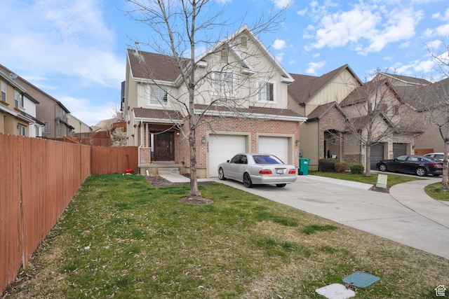 traditional-style home with a front yard, fence, brick siding, an attached garage, and driveway