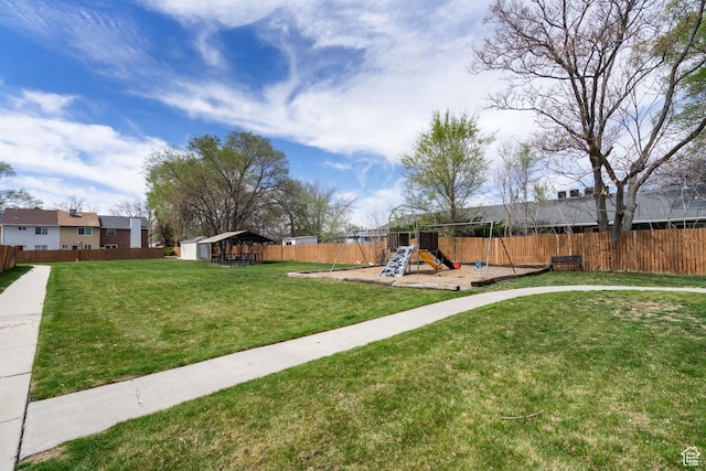 430 N 470 W Unit 14, Lehi, UT 84043 - view of yard with an outbuilding, a fenced backyard, and a playground