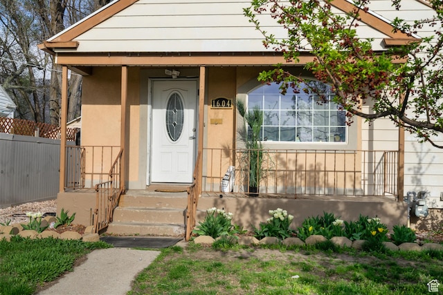 1604 Childs Ave, Ogden, UT 84404 - doorway to property with stucco siding and fence