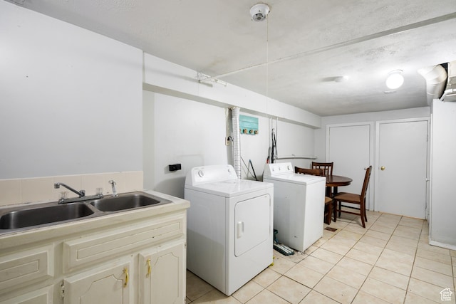 1604 Childs Ave, Ogden, UT 84404 - laundry area featuring a sink, independent washer and dryer, cabinet space, and light tile patterned flooring