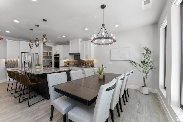 5238 W 2440 S, Hurricane, UT 84737 - dining area featuring visible vents, baseboards, an inviting chandelier, light wood-style floors, and recessed lighting