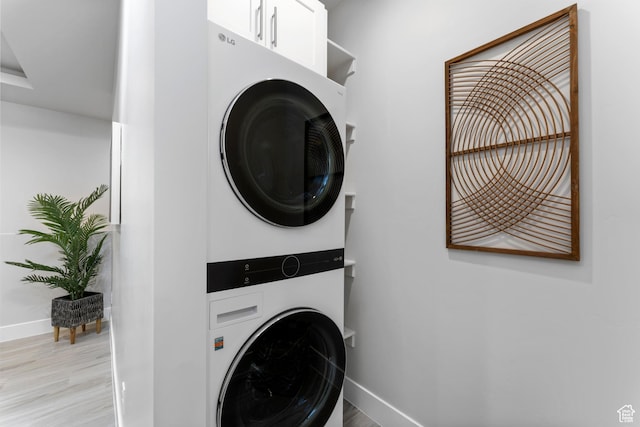 5238 W 2440 S, Hurricane, UT 84737 - laundry area with baseboards, light wood finished floors, and stacked washing maching and dryer