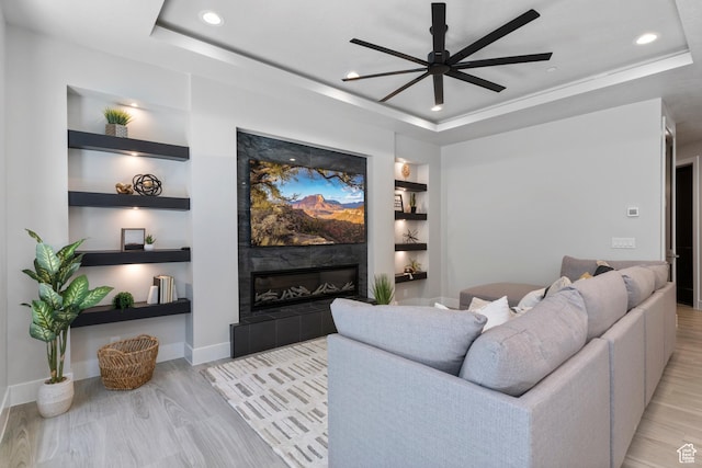 5266 W 2480 S Unit 149, Hurricane, UT 84737 - living area with a tray ceiling, a ceiling fan, and light wood-style flooring