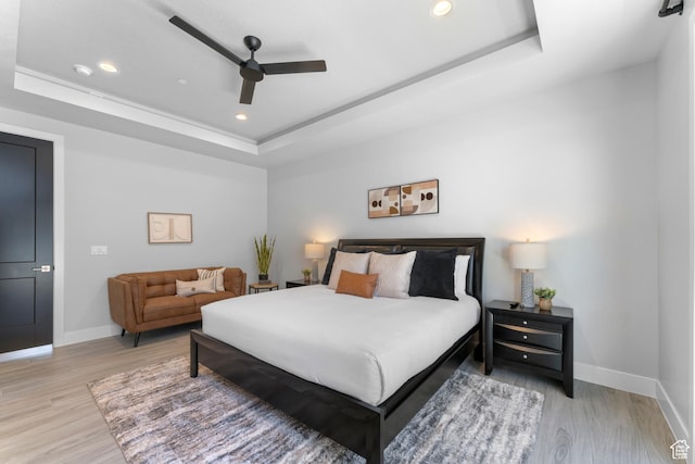 5266 W 2480 S Unit 149, Hurricane, UT 84737 - bedroom with light wood-type flooring, baseboards, a raised ceiling, and recessed lighting