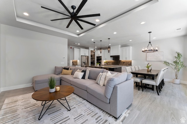 5266 W 2480 S Unit 149, Hurricane, UT 84737 - living area with light wood-type flooring, baseboards, a raised ceiling, and recessed lighting