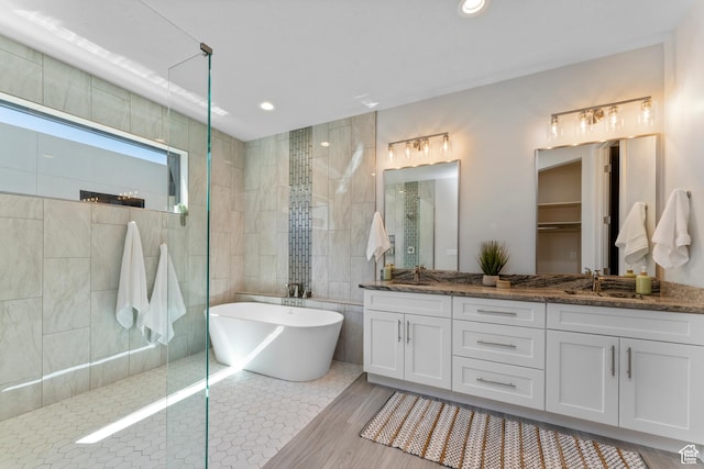 5266 W 2480 S Unit 149, Hurricane, UT 84737 - full bathroom with a sink, a soaking tub, a walk in shower, and double vanity