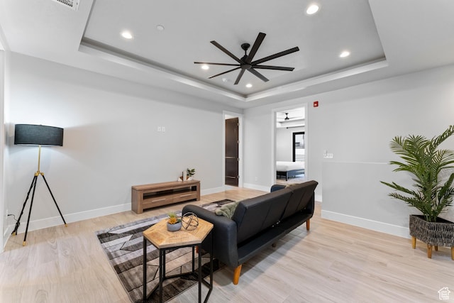 5266 W 2480 S Unit 149, Hurricane, UT 84737 - living room featuring baseboards, recessed lighting, a tray ceiling, ceiling fan, and light wood finished floors