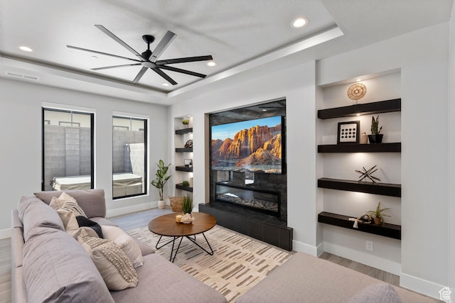5266 W 2480 S Unit 149, Hurricane, UT 84737 - living area featuring ceiling fan, baseboards, built in shelves, and recessed lighting