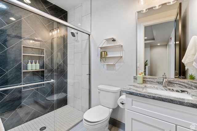 5266 W 2480 S Unit 149, Hurricane, UT 84737 - bathroom featuring toilet, vanity, and a stall shower