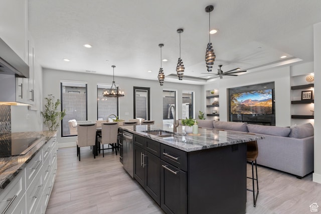 5266 W 2480 S Unit 149, Hurricane, UT 84737 - kitchen with a kitchen bar, white cabinets, dishwasher, a sink, and black electric cooktop