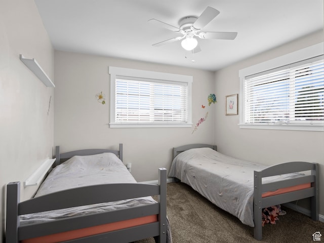 bedroom featuring ceiling fan, baseboards, and carpet floors