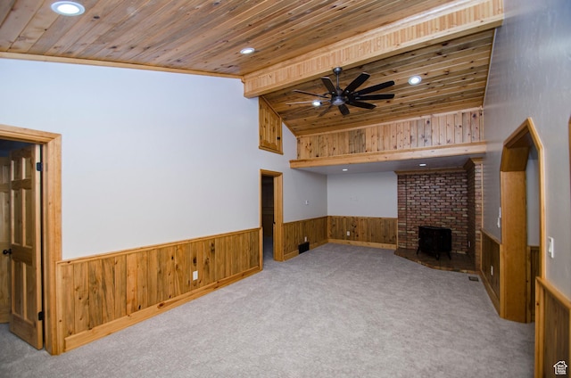 3804 E 2050 N, Eden, UT 84310 - unfurnished living room featuring a fireplace, carpet floors, wood ceiling, wood walls, and wainscoting