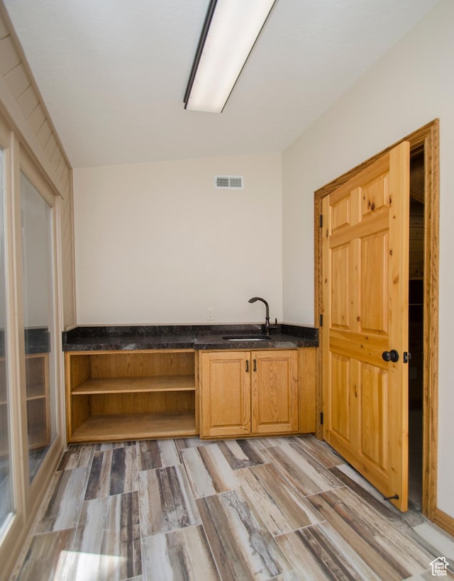 3804 E 2050 N, Eden, UT 84310 - bar with light wood finished floors, a sink, and visible vents