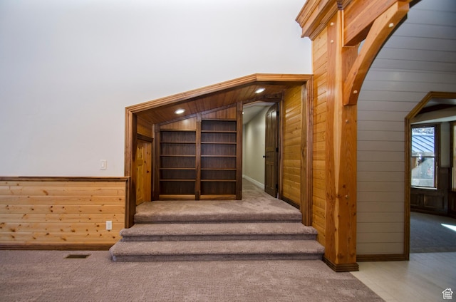 3804 E 2050 N, Eden, UT 84310 - stairway featuring arched walkways, carpet flooring, visible vents, and wooden walls