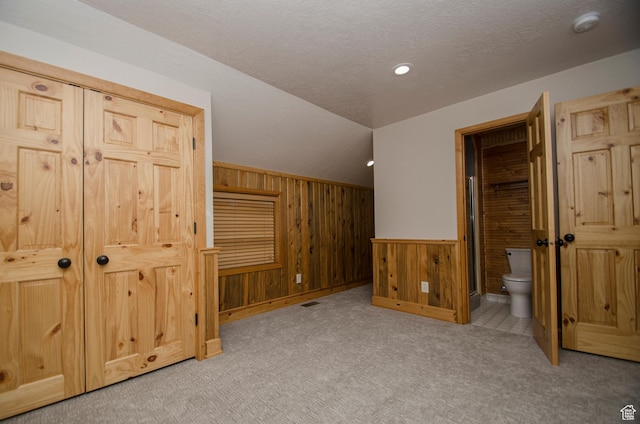 3804 E 2050 N, Eden, UT 84310 - additional living space featuring visible vents, wood walls, vaulted ceiling, and carpet floors