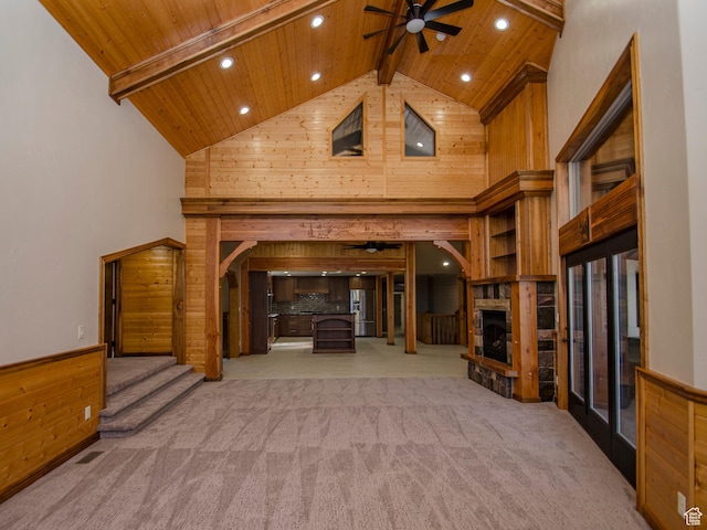 3804 E 2050 N, Eden, UT 84310 - unfurnished living room with high vaulted ceiling, ceiling fan, a stone fireplace, wood ceiling, and wooden walls