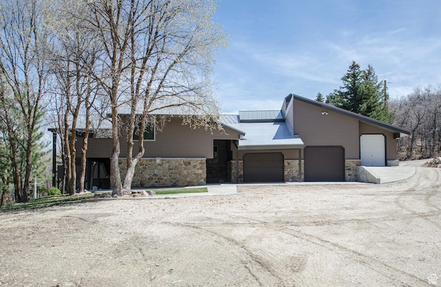 3804 E 2050 N, Eden, UT 84310 - view of front facade with an attached garage, driveway, and stone siding