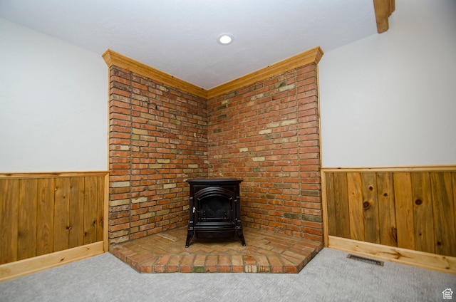 3804 E 2050 N, Eden, UT 84310 - details with a wood stove, visible vents, a wainscoted wall, and carpet flooring