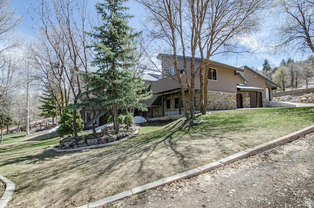 3804 E 2050 N, Eden, UT 84310 - view of front of home featuring a front yard and stone siding