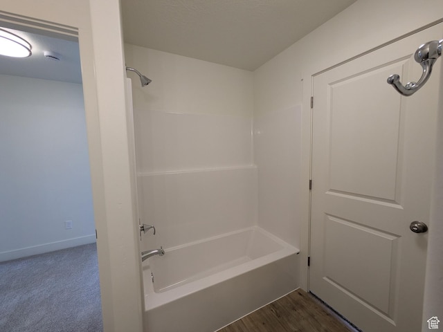full bathroom featuring baseboards and washtub / shower combination