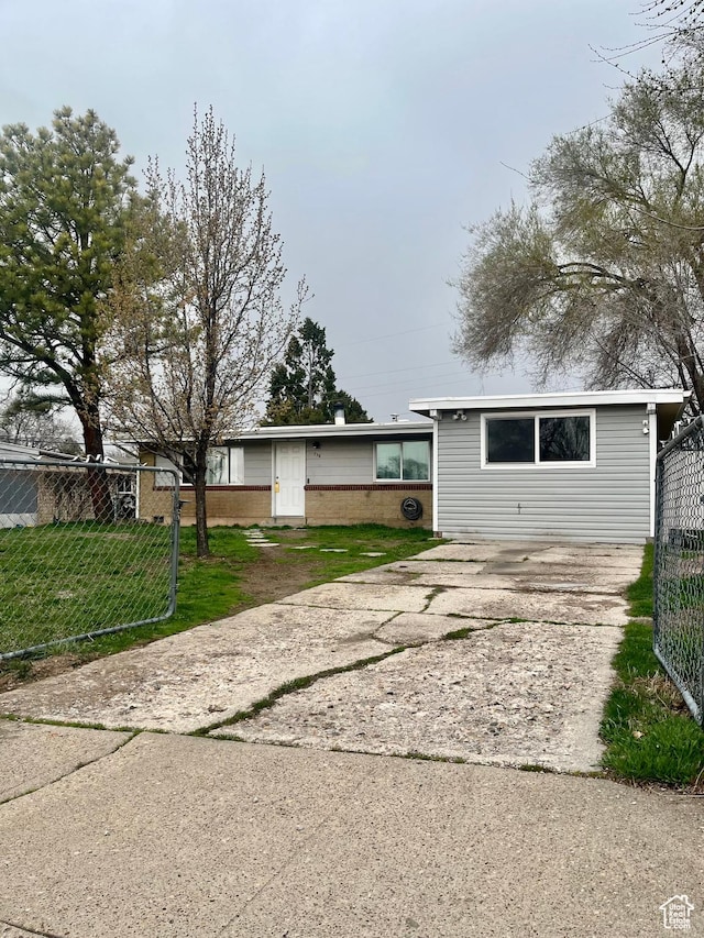 exterior space with driveway and fence