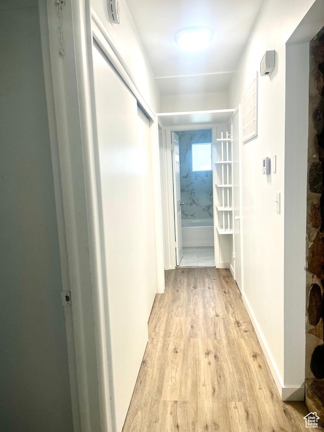 hallway with light wood-type flooring