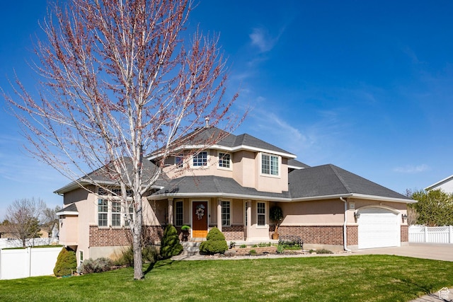 2115 N 5 E, Layton, UT 84041 - view of front of house featuring brick siding, stucco siding, concrete driveway, and a garage