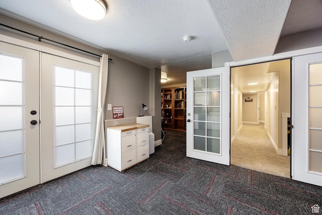 2115 N 5 E, Layton, UT 84041 - doorway to outside featuring french doors, dark colored carpet, and a textured ceiling