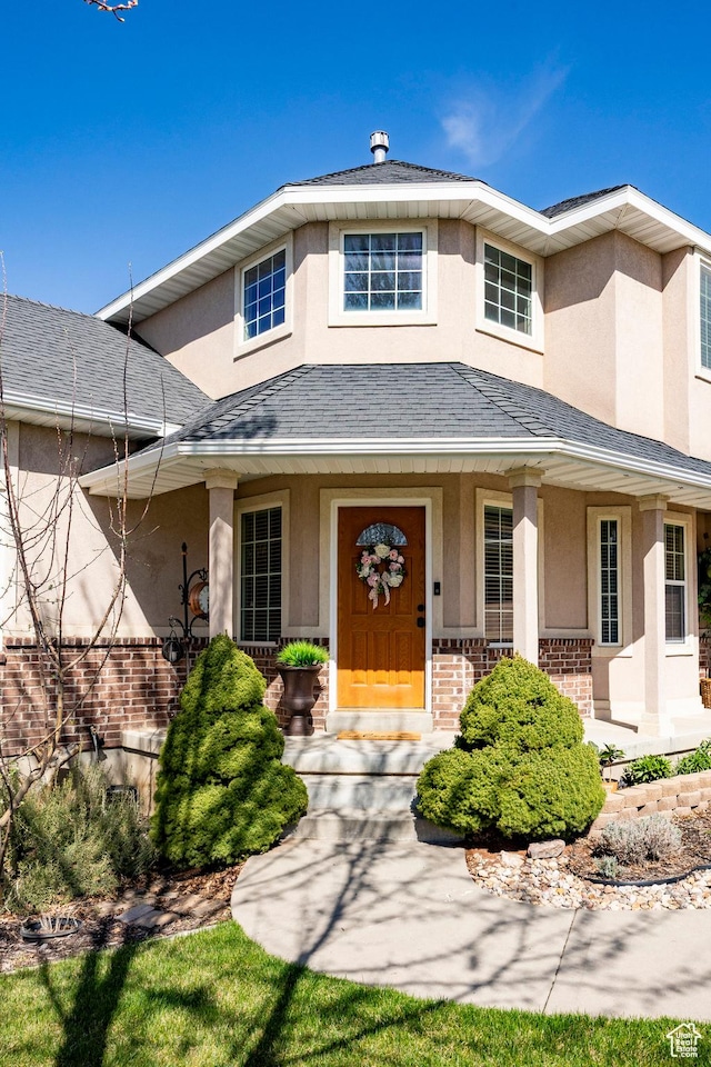 2115 N 5 E, Layton, UT 84041 - view of front facade with stucco siding, a porch, and brick siding