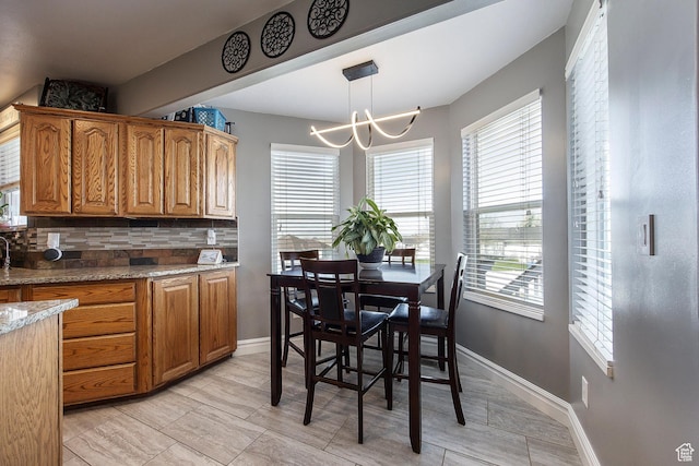 2115 N 5 E, Layton, UT 84041 - dining room featuring a chandelier and baseboards