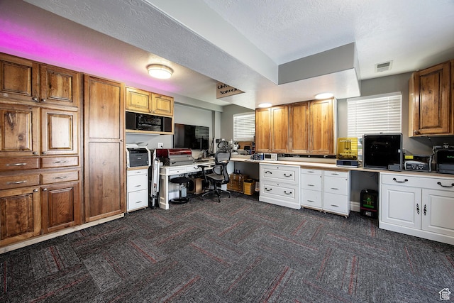 2115 N 5 E, Layton, UT 84041 - office space with dark colored carpet, built in study area, plenty of natural light, and a textured ceiling