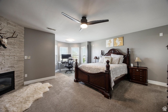 2115 N 5 E, Layton, UT 84041 - carpeted bedroom featuring a desk, a ceiling fan, a stone fireplace, and baseboards