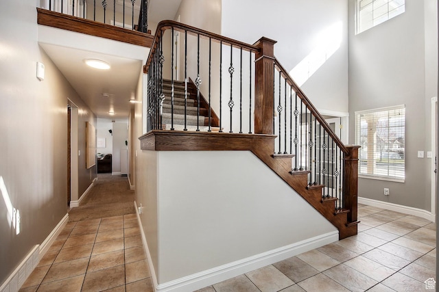 2115 N 5 E, Layton, UT 84041 - stairway featuring a towering ceiling, baseboards, and tile patterned floors