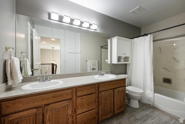 2115 N 5 E, Layton, UT 84041 - full bathroom featuring double vanity, shower / bath combo, and toilet
