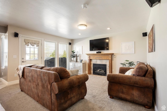2115 N 5 E, Layton, UT 84041 - living room with carpet floors, a tiled fireplace, baseboards, and recessed lighting