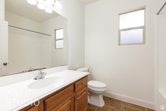 full bathroom with walk in shower, tile patterned flooring, toilet, vanity, and baseboards