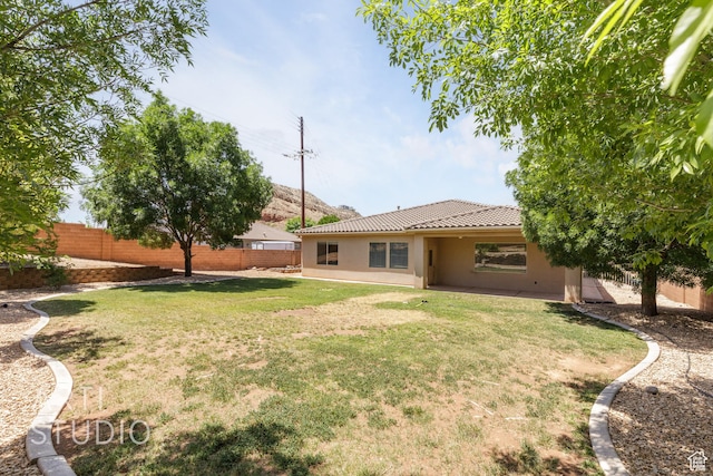 1971 S Great Basin Dr, Washington, UT 84780 - fenced backyard with a patio