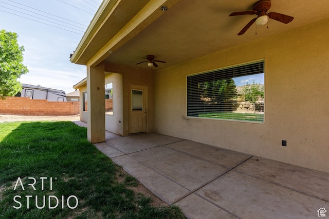 view of patio with fence and ceiling fan