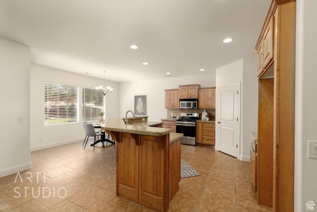 1971 S Great Basin Dr, Washington, UT 84780 - kitchen with stainless steel appliances, a breakfast bar area, recessed lighting, light tile patterned floors, and decorative backsplash