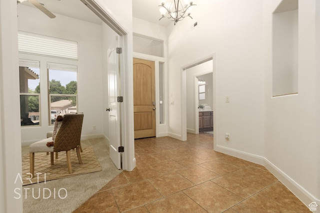 1971 S Great Basin Dr, Washington, UT 84780 - entrance foyer with a chandelier and light tile patterned floors