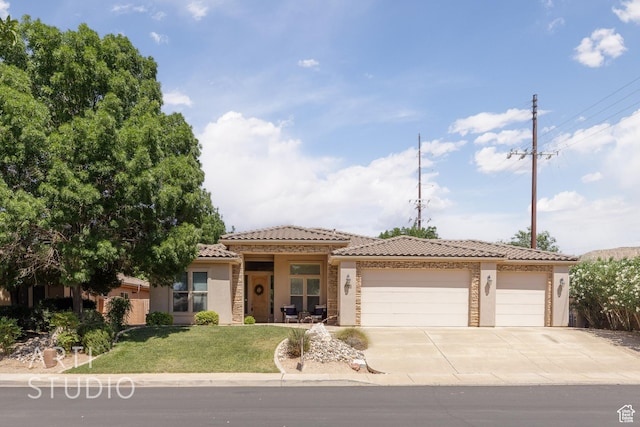 1971 S Great Basin Dr, Washington, UT 84780 - view of front facade featuring a garage, a tile roof, stucco siding, a front yard, and driveway