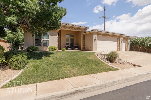 1971 S Great Basin Dr, Washington, UT 84780 - mediterranean / spanish-style home with stucco siding, driveway, a tiled roof, a front yard, and a garage