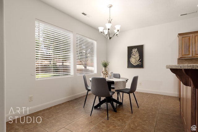 1971 S Great Basin Dr, Washington, UT 84780 - dining room featuring a chandelier and tile patterned flooring