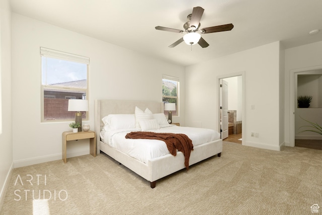 1971 S Great Basin Dr, Washington, UT 84780 - bedroom with light colored carpet, ensuite bathroom, and ceiling fan