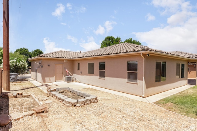 1971 S Great Basin Dr, Washington, UT 84780 - back of house with a tiled roof, stucco siding, and a patio