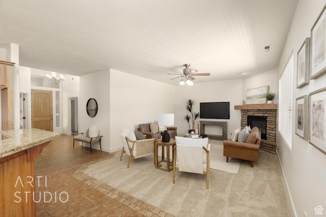 1971 S Great Basin Dr, Washington, UT 84780 - living room featuring a stone fireplace, ceiling fan, and a chandelier