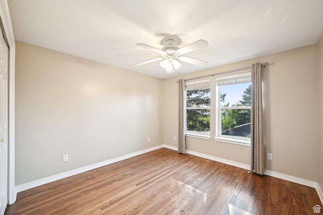 3391 E Brockbank Dr S, Millcreek, UT 84124 - unfurnished room featuring wood finished floors, baseboards, and a ceiling fan