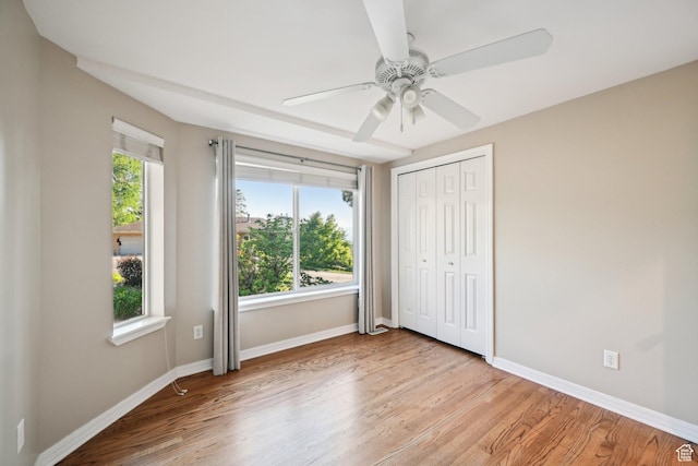 3391 E Brockbank Dr S, Millcreek, UT 84124 - unfurnished bedroom with baseboards, light wood finished floors, a closet, and ceiling fan