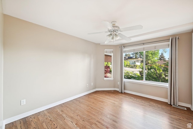 3391 E Brockbank Dr S, Millcreek, UT 84124 - unfurnished room with baseboards, light wood-style flooring, and a ceiling fan